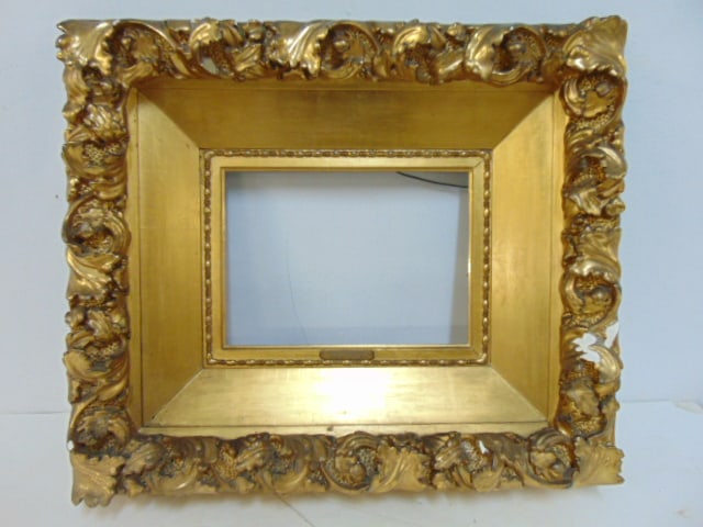 Gilt carved wood frame with applied plaster decoration, has several chips, opening is 12" by 9" (1 of 4)