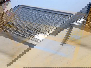 Steel coffee table made from ship's deck grate, with glass top, handmade, nautical