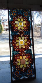 Large leaded & jeweled window, some panels are cracked, 64" by 21"