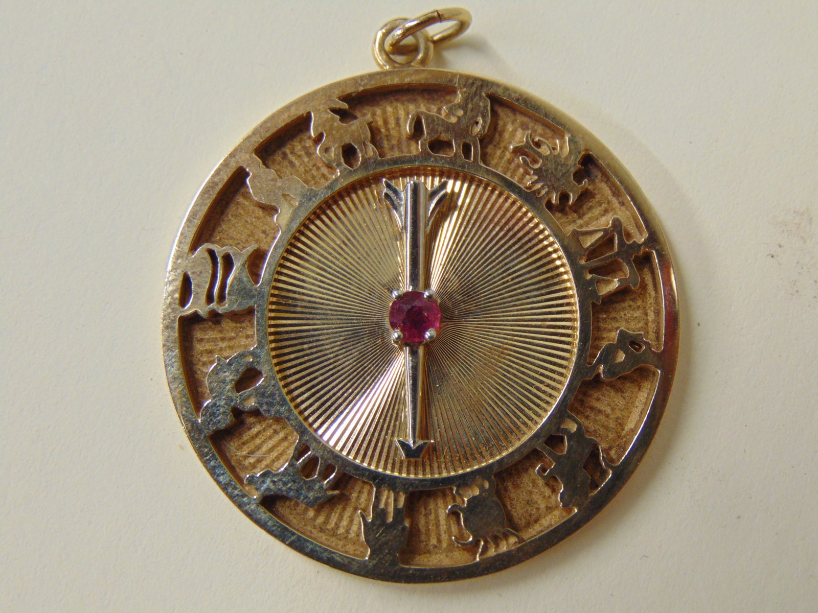 Jewelry. Vintage 14kt gold Danker zodiac pendant w/ gem stone,18 grams. Astrology chart with arrow t: Jewelry. Vintage 14kt gold Danker zodiac pendant w/ gem stone,18 grams. Astrology chart with arrow that moves. charm/pendent, hallmark 14k D, 1 1/2" across, good condition