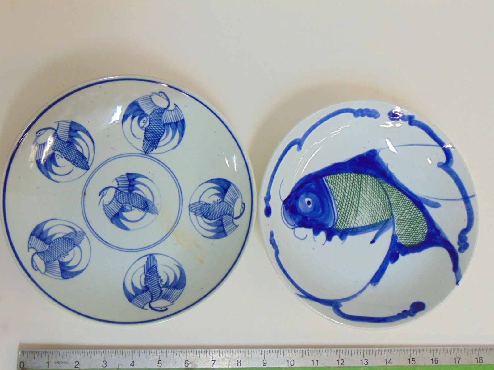 Two porcelain Chinese plates, bowls, one with fish design, other with bird design, diameter is 9": Two porcelain Chinese plates, bowls, one with fish design, other with bird design, diameter is 9"