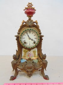 Figural spelter clock by New Haven Clock Co. , with porcelain plaque & finial (transferware),
