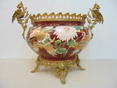 Bronze mounted jardiniere with Japanese scenes, bronze base and winged dragon handles, 21" wide, 13"