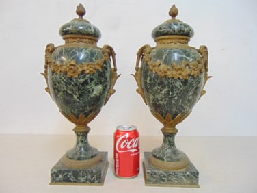 Pair green marble garnitures, urns with bronze trim & lids, height is 17"
