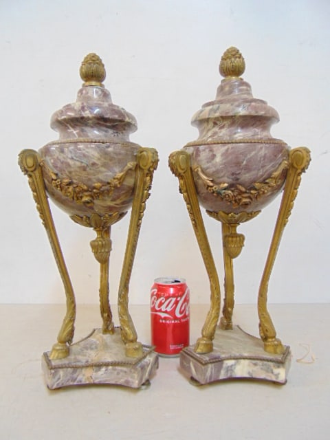 Pair bronze mounted marble garnitures with pinecone finials & hoof feet, one has cracked, repaired: Pair bronze mounted marble garnitures with pinecone finials & hoof feet, one has cracked, repaired base, height is 18.5", diameter is 7"