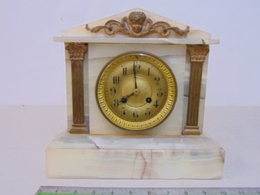 Onyx mantle clock with bronze mounted decoration, gilt face, clock is 10 5/8" by 6", height is 10",