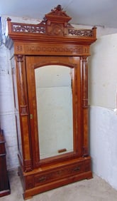 Victorian armoire with single mirrored door, carved crest & drawer in base, walnut with burl veneer