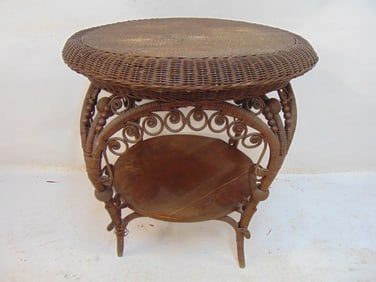 Round Victorian wicket table with decorative base, table is 29" in diameter, height is 30", bottom