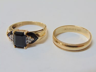 Jewelry. 2 Gold rings to include 14k yellow gold wedding band 2.40 grams, size 8, hallmark art