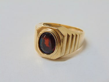 Jewelry. 14kt yellow gold & garnet ring, 8.95 grams, size 10 1/2, oval garnet approx. 7mm X 10mm