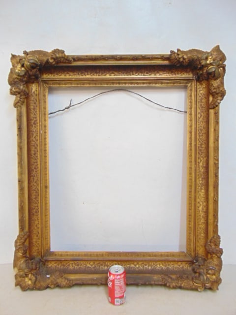Fancy gilt frame, applied leaf decorations, has several chips, outer dimensions are 36.5" by 32.75", (1 of 5)