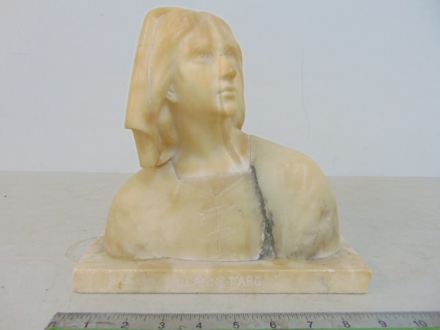 Carved alabaster bust "Jeanne D'Arc", unsigned, has repair to corner base, 9 3/8" by 4 5/8", height: Carved alabaster bust "Jeanne D'Arc", unsigned, has repair to corner base, 9 3/8" by 4 5/8", height is 9"