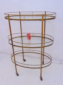 Brass oval three tiered cart or shelf, takes three glass shelves, one is missing, cart is 30.5"