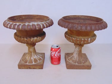 Pair small cast iron urns by Husqvarna, height is 11 5/8", diameter is 11"