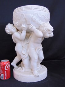 Carved 19th century Italian marble planter, planter held up by three putti figures, in white marble,