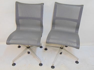 Pair Herman Miller mesh swivel chairs, chairs are 18.5" wide, 22" deep, height is 36"