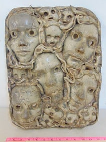 Studio pottery sculpture, collage with faces, grey glaze, sculpture is 16.5" by 12.75"