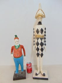 2 figural wood carvings, painted, figure with hat in black & white diamond pattern, height is 30" &