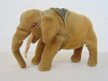 Vintage elephant plush mohair circus toy, missing a tusk, 12" long, 8.5" tall, 4.5" wide.
