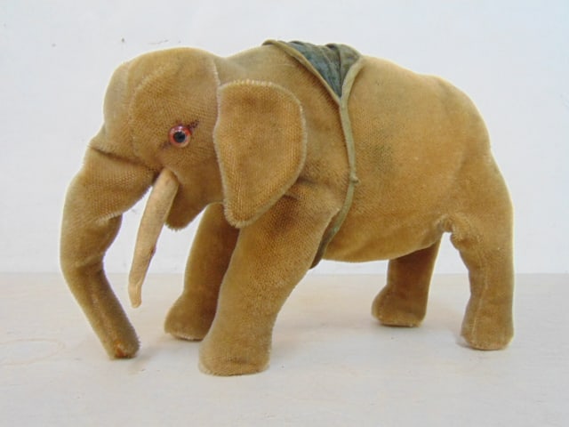 Vintage elephant plush mohair circus toy, missing a tusk, 12" long, 8.5" tall, 4.5" wide.: Vintage elephant plush mohair circus toy, missing a tusk, 12" long, 8.5" tall, 4.5" wide.