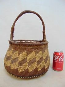 North-West Coastal basket with handle (Siletz), 14.25" tall, diameter is 11.5"