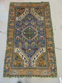 Scatter rug, center medallion, in blue, brown border, carpet is 75" by 44"