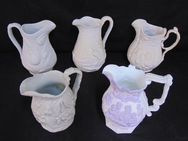 5 Parian & relief molded pitchers, various designs, tallest one is 9.5", all in good condition.