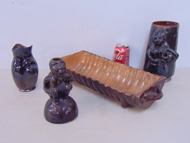 4 pieces redware, mug with figural decoration of a girl with jug; monkey candle holder, partial