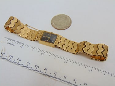 Jewelry. Vintage 14kt Geneva gold wristwatch, 17 jewels, 32.88 grams, with safety chain, hallmark