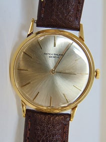 Jewelry. Vintage PATEK PHILIPPE 18kt gold wristwatch, Swiss made, aftermarket brown leather band.