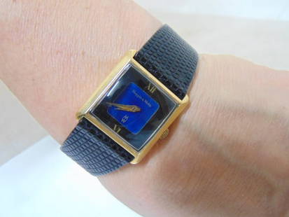 Jewelry. Vintage Mappin & Webb 18kt gold wristwatch, serial no. 60805 10228. hallmark 18k, touchmark: Jewelry. Vintage Mappin & Webb 18kt gold wristwatch, serial no. 60805 10228. hallmark 18k, touchmark 750 flanked by scales. blue crystal or sapphire dial, replacement band black lizard Speidel. estate