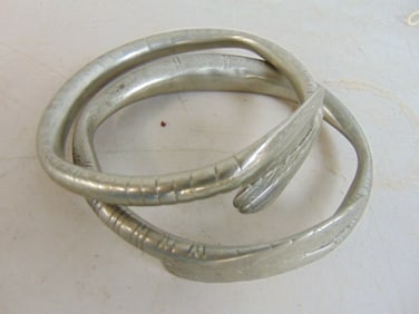 Thai arm bracelets, 6 pairs, decorated metal, 4" in diameter.