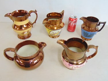 Lot 5 Lusterware pitchers with various decorations, largest pitcher is 7.25" tall, 8" wide