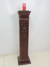 Mahogany pedestal with applied carved wood decorations, pedestal is 46" tall,11.75" wide, 11.75"