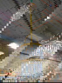 3 tiered crystal chandelier on brass frame, hanging fixture is 38" tall, diameter is 10", has singl