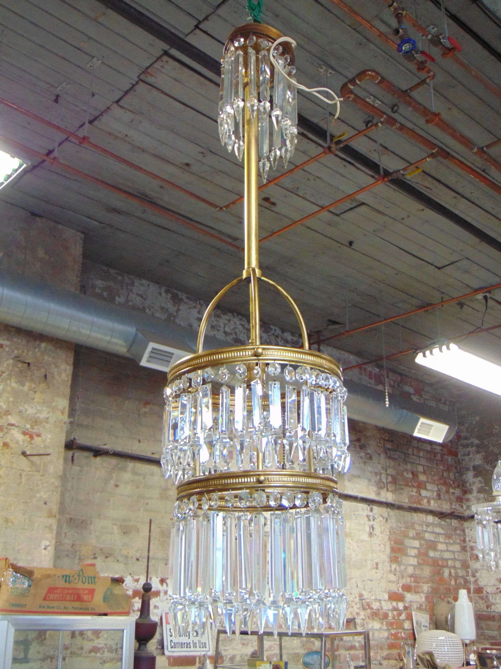 3 tiered crystal chandelier on brass frame, hanging fixture is 38" tall, diameter is 10", has singl (1 of 4)