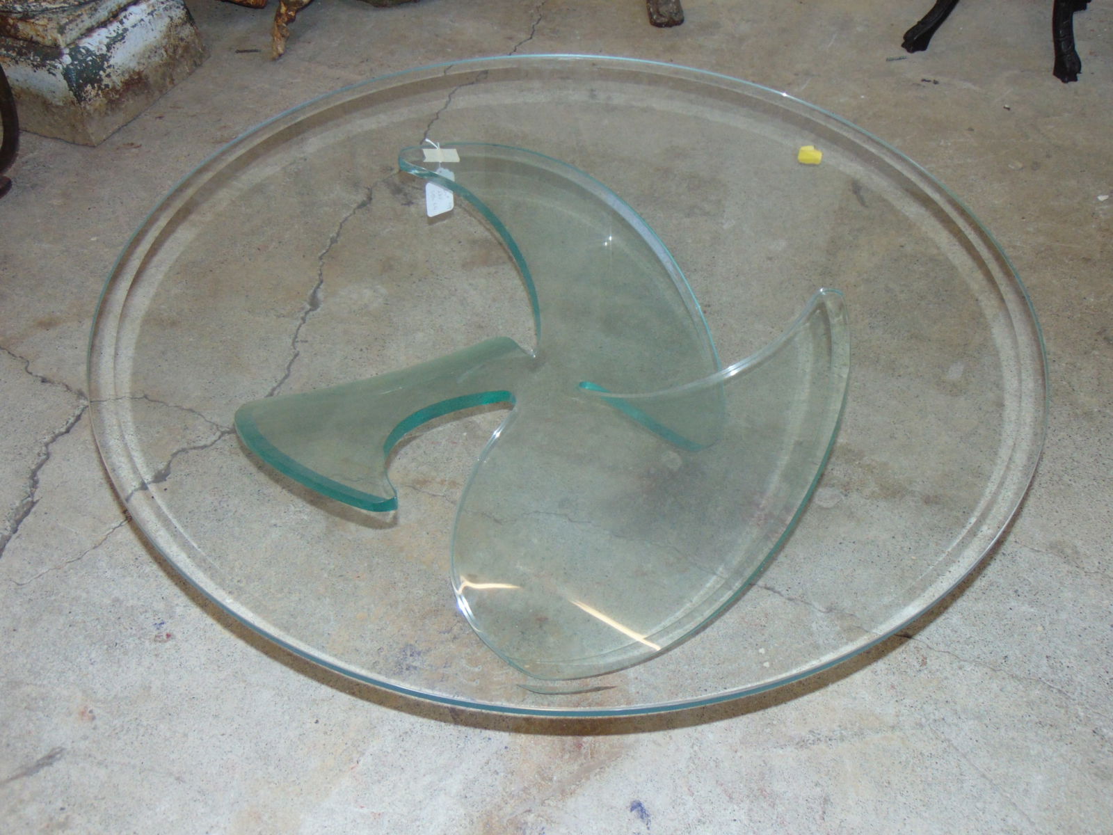 Glass top coffee table on Lucite base, base shaped like a boat propeller, top table is 42" (1 of 4)