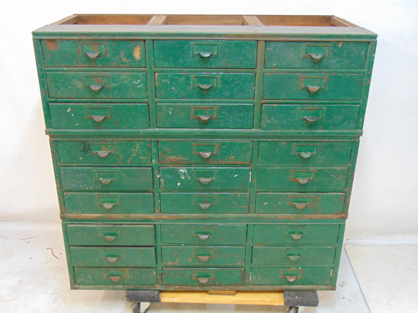 Oak file cabinet, in three sections, base & top missing, front is painted green, sides are scratched (1 of 4)