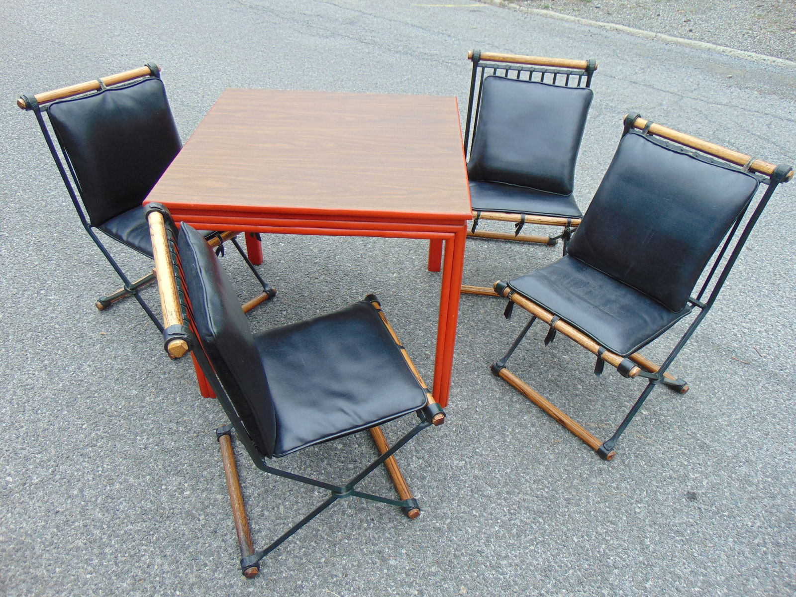 Square table with 4 metal chairs & wood Cleo Baldon mid Century chairs, table has painted faux bambo: Square table with 4 metal chairs & wood Cleo Baldon mid Century chairs, table has painted faux bamboo base, table is 32.5" by 32.5", height is 29", chairs are labeled "Terra"
