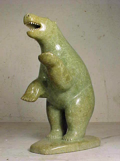 Inuit stone carving, bear, sgd. Mike Kotaigo: Eskimo carving, bear standing on it's rear legs, mouth open with teeth exposed, in green stone, base has been repaired, signed "Kotaigo", height is 8". Mike Kotaigo began carving at the age of fifteen