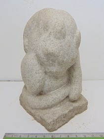 Stone carving, cat licking belly, by Mark Morrison, in light grey carved granite, 9.5" wide, 9"