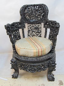 Carved Chinese chair, extensively carved with dragons, flowers, with cushion, chair is 25.75" wide,