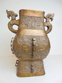 Large Asian bronze vase with decorations, handles, drilled, vase is 12.75" wide, 9.5" deep, height