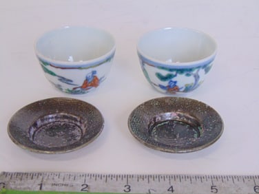 2 small Chinese porcelain cups and 2 saucers, saucers are 2.5" ion diameter and have a metallic