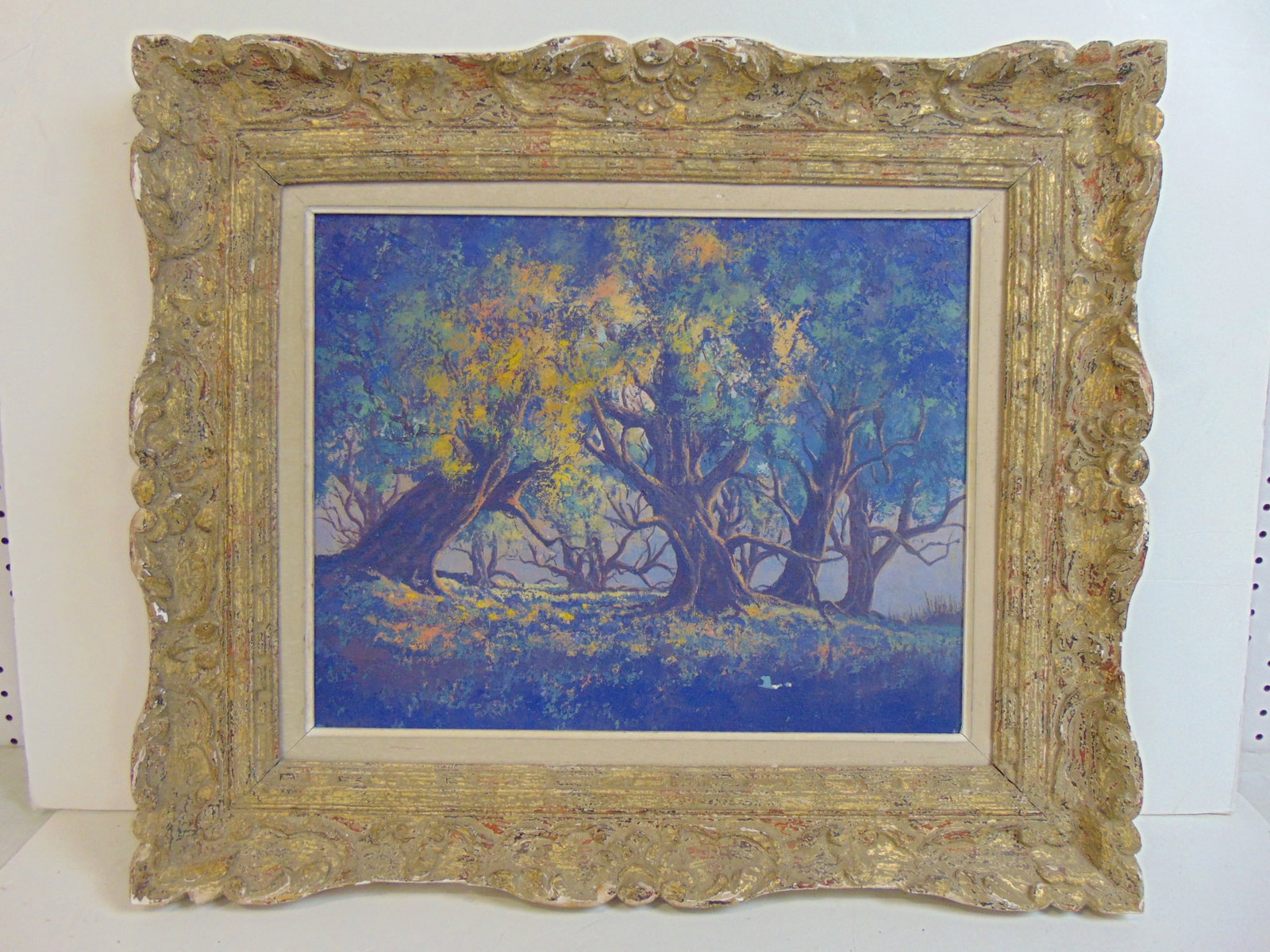Painting, large trees, blue hues, unsigned, oil on canvas, in carved frame by A. Miller, 24.5" by: Painting, large trees, blue hues, unsigned, oil on canvas, in carved frame by A. Miller, 24.5" by 28.75", small flake bottom right.