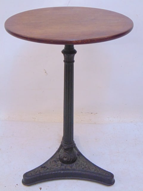 Small stand on decorative cast iron base with round wood top, diameter top is 14.75", height is (1 of 4)