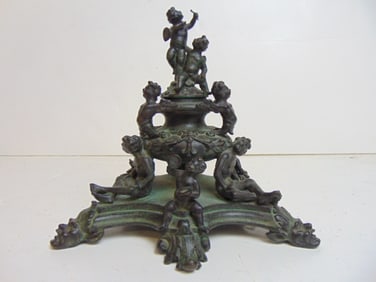 Bronze figural inkwell or candelabra base, decorated with various putti & figures, base is 8" by 8",