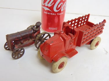 Cast iron toy truck & tractor, in original paint, truck is 6.5" long, tractor is 3.75"