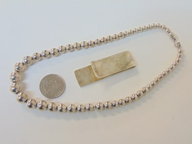 Jewelry. (2) pc Sterling Tiffany & Co. to include money clip & bead necklace. money clip 0.78 troy