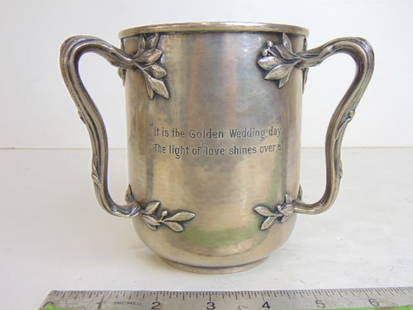 Sterling silver loving cup, engraved "It is the Golden Wedding day, The light of love shines over: Sterling silver loving cup, engraved "It is the Golden Wedding day, The light of love shines over all". 2 pint size, 6" wide (ear to ear), height is 5 1/8", 17.5 troy